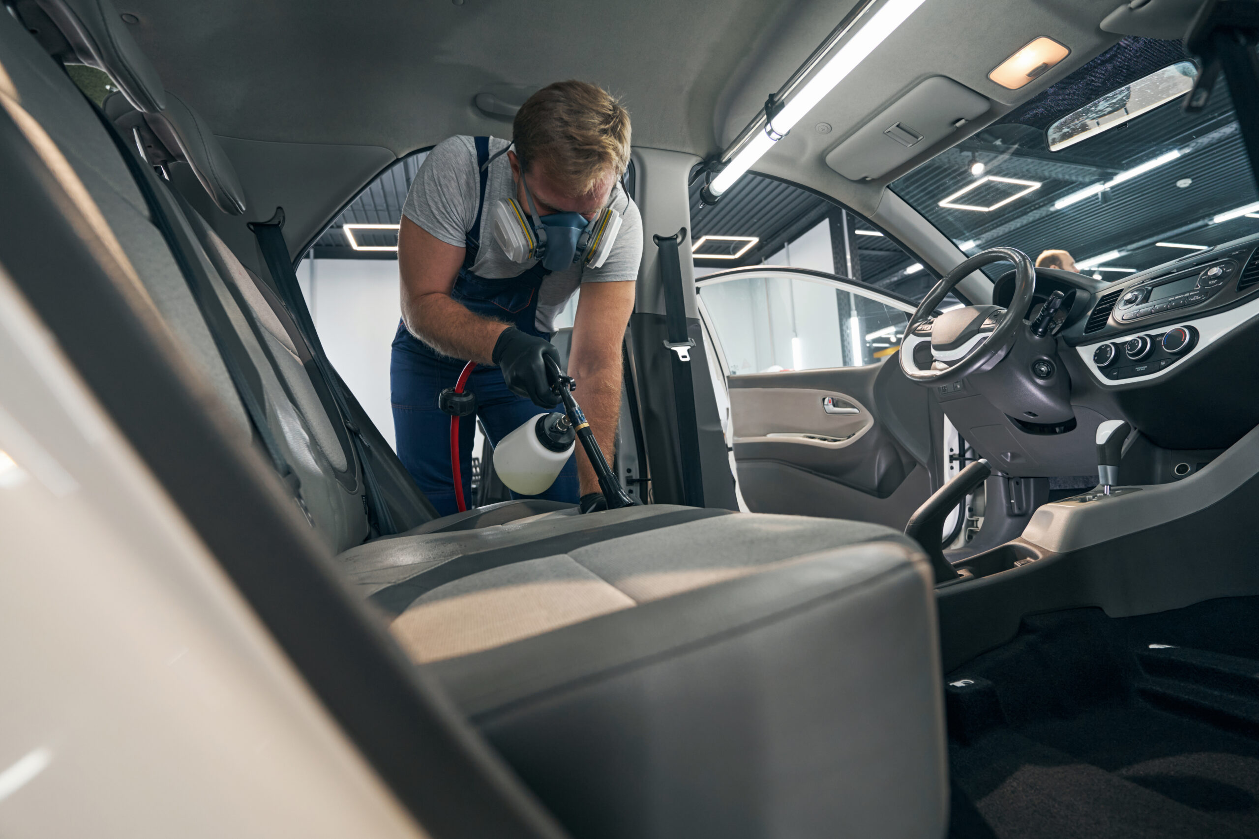 serviceman makes chemical cleaning of car interior 2024 10 18 08 39 15 utc scaled